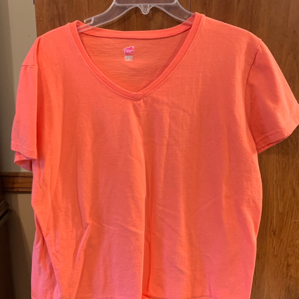 Hanes short sleeved shirt , peach . Womans large